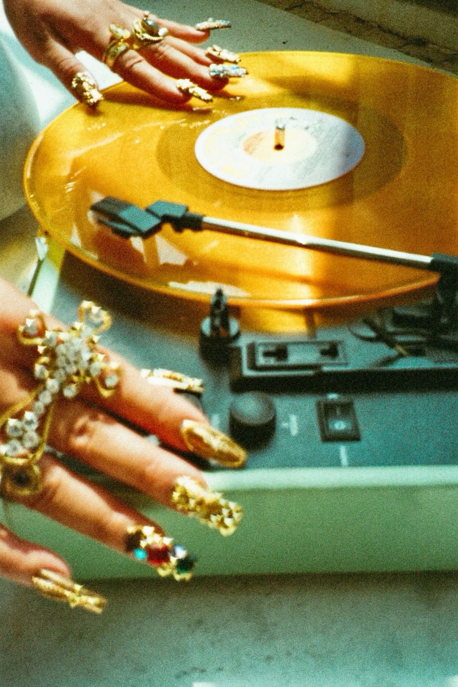 A Friday Club charm bracelet on a wrist